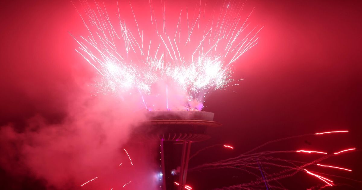 Fireworks, drones shine in foggy skies and smoke above Space Needle to