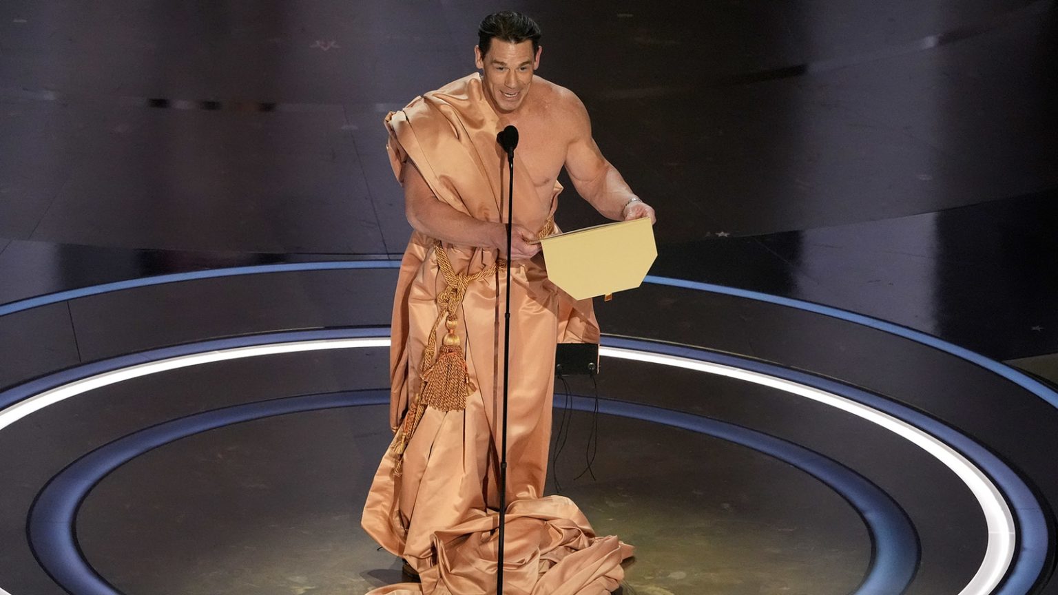 John Cena strips down on Oscars stage to announce winner of best