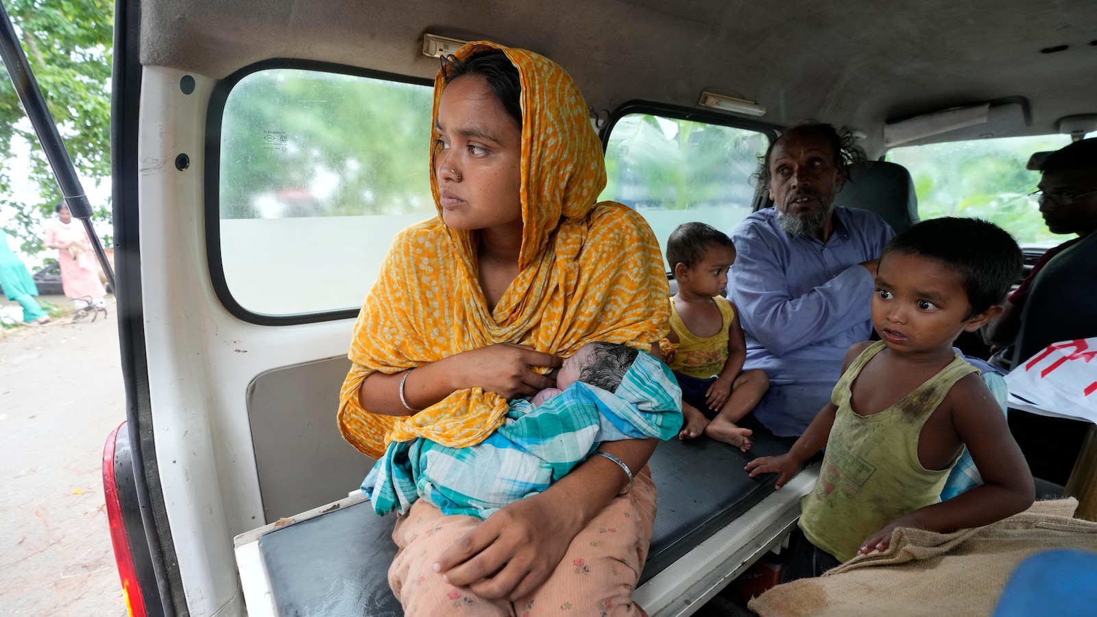 Indian mother delivers baby on boat as her river island is inundated by ...